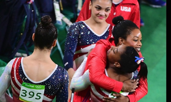 US Women Gymnastics team members  Simone Biles, Gabby Douglas, Aly Raisman, Laurie Hernandez and Madison Kocian congratulate each other on winning the gold