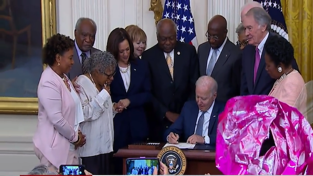   US President Joe Biden signs  the Juneteenth National Holiday bill with  Opal Lee attending, June 17 2021